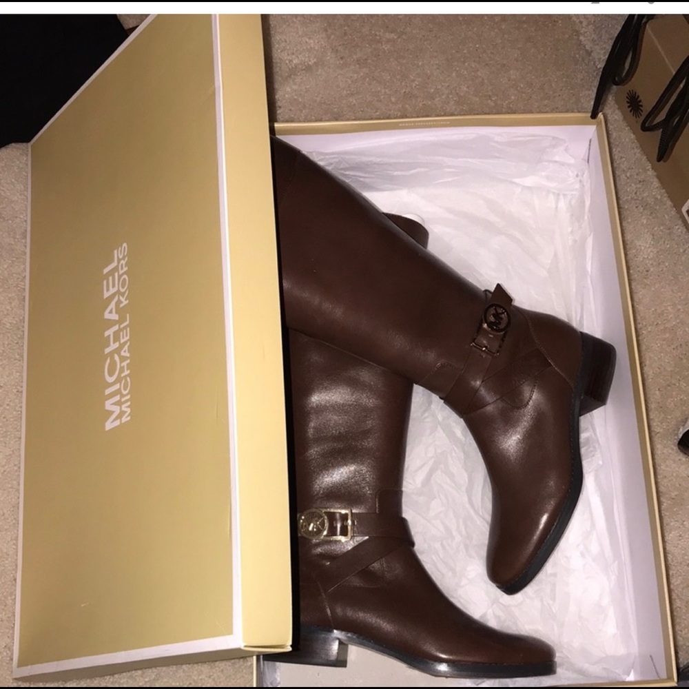 NWT on box, Michael Kors brown leather boots. Gold hardware, worn one time.